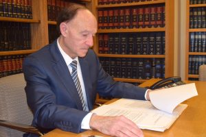 Jules Haas Attorney at Law reading a document